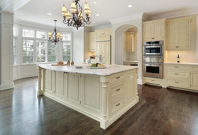 a modern kitchen with newly installed laminate floors in Berlin Center OH